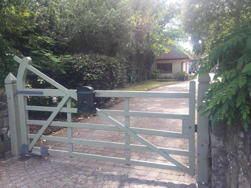 a gate to a driveway with a fence at The Lodge at Bodenlodge in Malahide