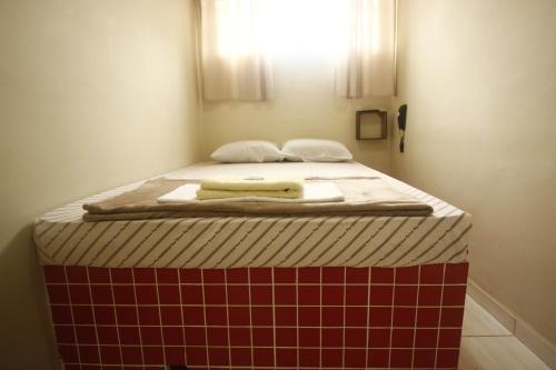 A bed or beds in a room at HOTEL INTERLAGOS