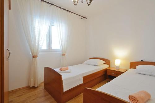 Säng eller sängar i ett rum på Apartment Jakov Grscica