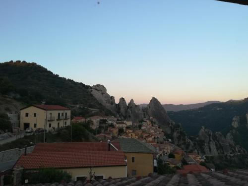 a view of a town with mountains in the background at Monserrat in Castelmezzano