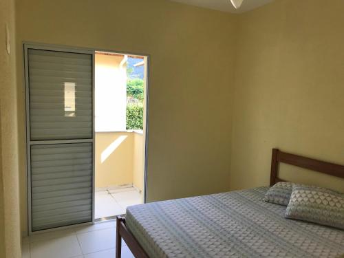 Postelja oz. postelje v sobi nastanitve Mar e Lua Flats - Maresias