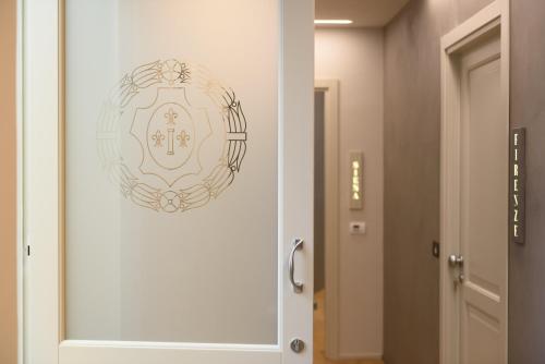 a door in a hallway with a plate on it at Palazzo Vasarri - Luxury design suites in Montevarchi