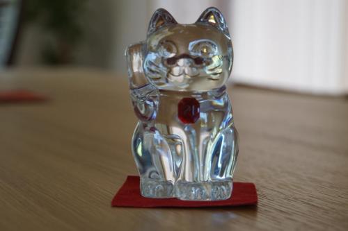 a glass figurine of a cat on a table at Yakunoyado Taguchi in Yakushima