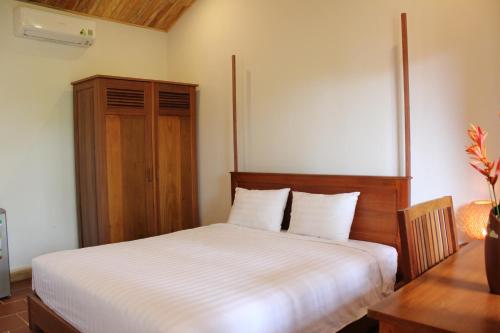 Postel nebo postele na pokoji v ubytování Sam Ong Lang Homestay
