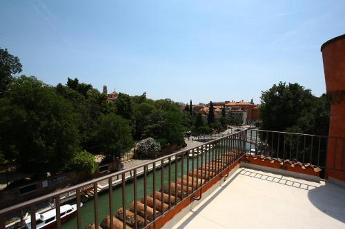 a balcony with a view of a street at Hotel Santa Chiara in Venice