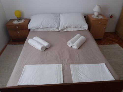 Postel nebo postele na pokoji v ubytování Apartman Nona