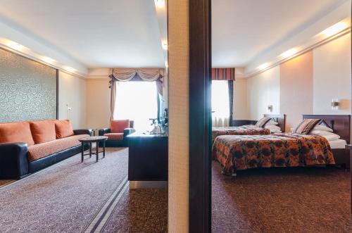 Postel nebo postele na pokoji v ubytování Hunguest Hotel Apollo