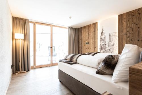 Кровать или кровати в номере Aktiv- und Wellnesshotel Traube- Post