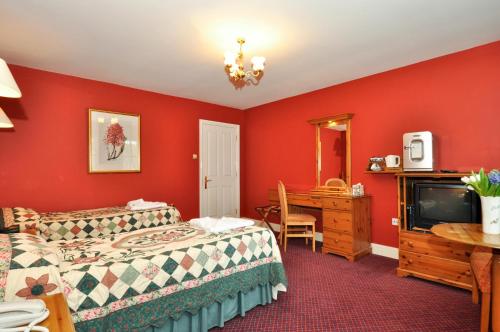 Lova arba lovos apgyvendinimo įstaigoje Boffin Lodge Guest House