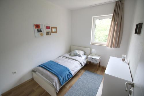 Postel nebo postele na pokoji v ubytování Apartments by Zec