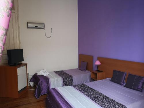 Katil atau katil-katil dalam bilik di Residencial S Juliao AL