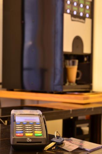 a cell phone sitting on top of a table at Music Hostel in Poltava