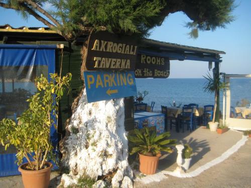 a sign for a restaurant on the beach at Beachfront Apartment Kato Zakros in Káto Zákros