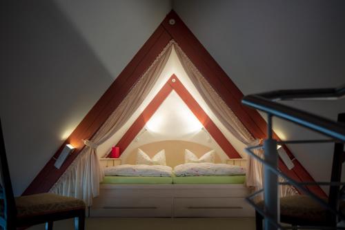 Llit o llits en una habitació de Gäste-Maisonette Martinus