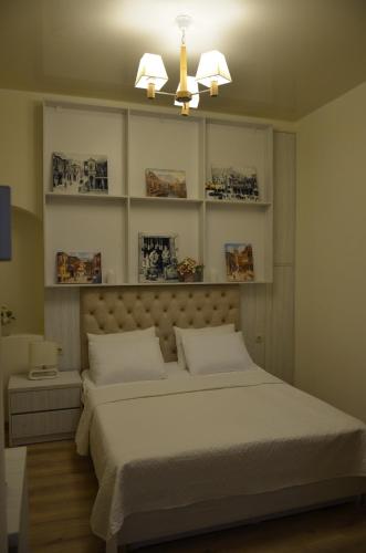 Postel nebo postele na pokoji v ubytování Hotel Griboedov