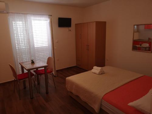 Postel nebo postele na pokoji v ubytování Apartmani Sea
