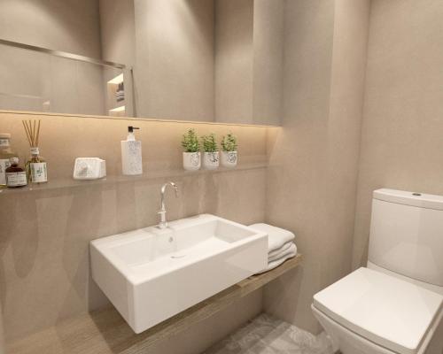 アテネにあるGreat Living Koukakiの白い洗面台とトイレのあるバスルーム