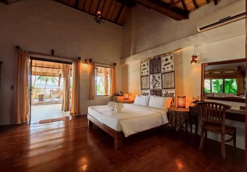 Postel nebo postele na pokoji v ubytování Koh Mak Cococape Resort