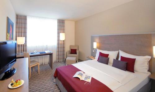 TV a/nebo společenská místnost v ubytování Mercure Hotel Frankfurt Eschborn Ost