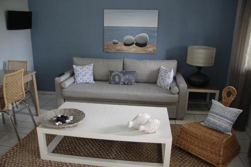 a living room with a couch and a coffee table at Captain Yiannis in Vathi, Ithaka