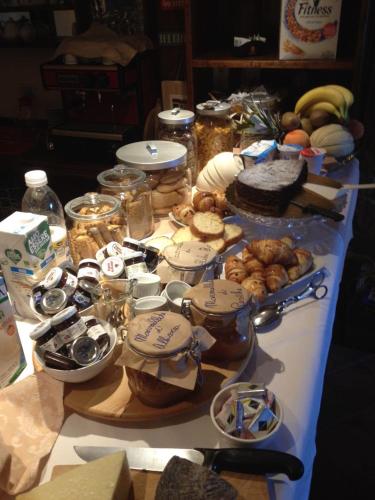 a table with many different types of food on it at Il Peschio in Pescocostanzo