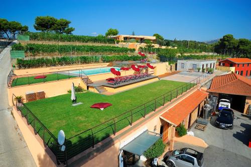 an aerial view of a building with a swimming pool at Poggio dei Gorleri in Diano Marina