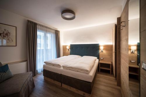 Ένα ή περισσότερα κρεβάτια σε δωμάτιο στο Villa Aurelia