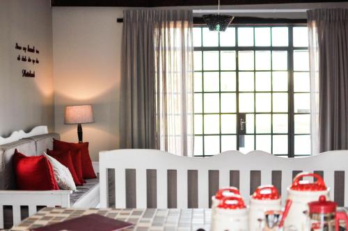 Postel nebo postele na pokoji v ubytování Avonsrus Guesthouse
