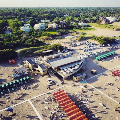 an aerial view of a parking lot with a building at Victoria Village in Carilo