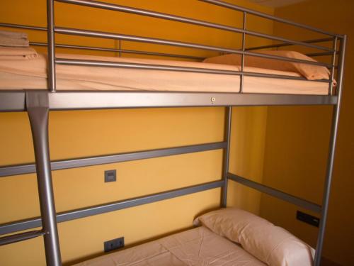 a bunk bed room with two bunk beds in it at Jimena in Burgos