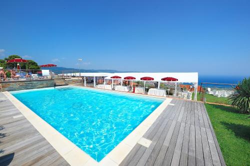 a swimming pool with a view of the ocean at Poggio dei Gorleri in Diano Marina