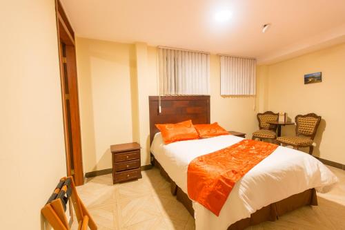 Säng eller sängar i ett rum på Hotel Saint Thomas