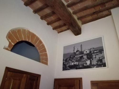 a room with two doors and a picture on the wall at Nonna Anna in Siena