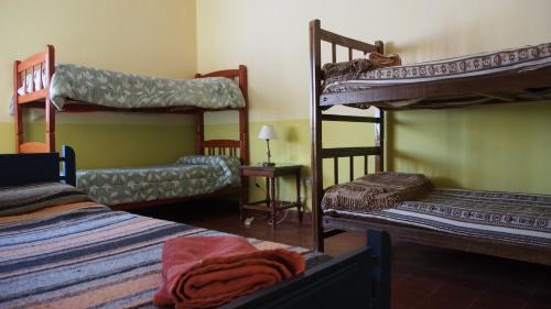 מיטה או מיטות בחדר ב-Inti Sayana