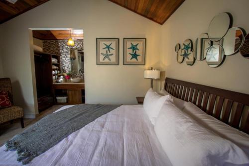 a bedroom with a large bed in a room at Marbucks Bed & Breakfast in San Pedro