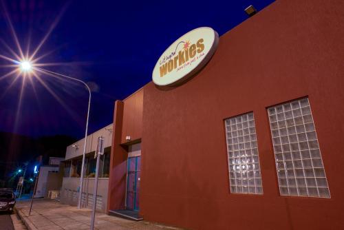 a building with a sign on the side of it at Lithgow Workies Club Motel in Lithgow