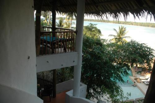 a view of the ocean from a balcony of a resort at Koh Mak Cococape Resort in Ko Mak