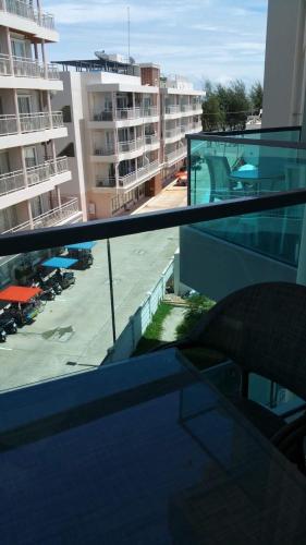 an apartment balcony with a view of a parking lot at Grand Blue Condominium by Mary in Mae Pim