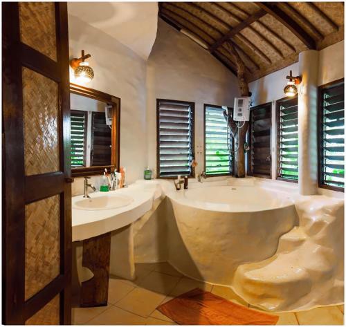 a large bathroom with two sinks and a large tub at Koh Mak Cococape Resort in Ko Mak