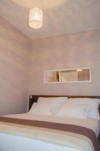 Postel nebo postele na pokoji v ubytování OzApartments