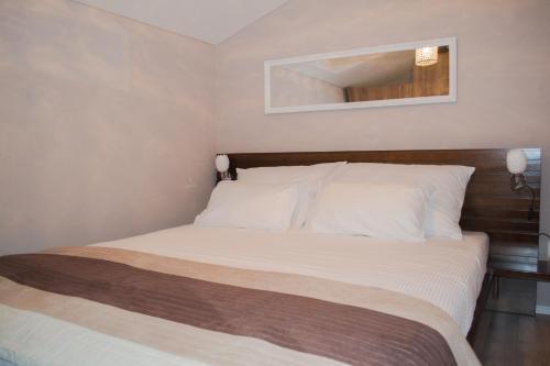 Postel nebo postele na pokoji v ubytování OzApartments