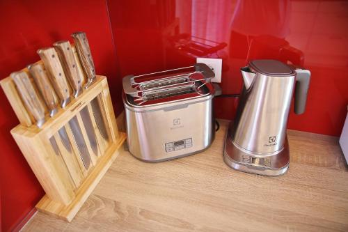 a toaster and a coffee maker on a counter at Apartment Lana in Pašman