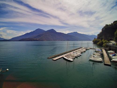 a group of boats docked at a dock in the water at Albergo Dongo in Dongo