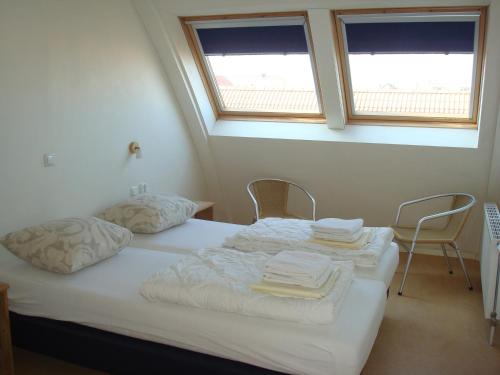 Postel nebo postele na pokoji v ubytování Hotel Rasch