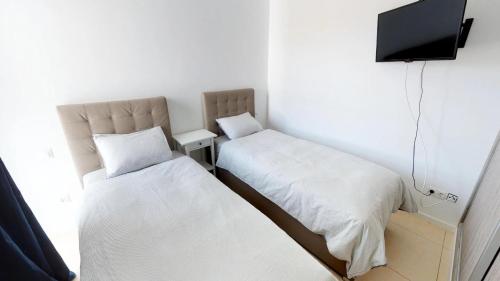 Posteľ alebo postele v izbe v ubytovaní Villa Casa Juma