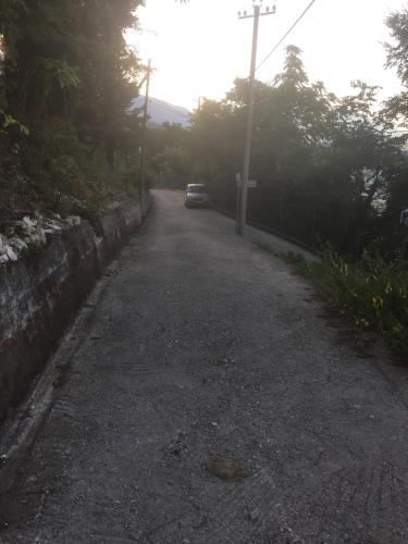 a car parked on the side of a road at Guest House Salaria in Gjirokastër