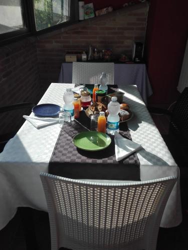 a table with a plate of food on it at Rifugio Nel Bosco in Rieti