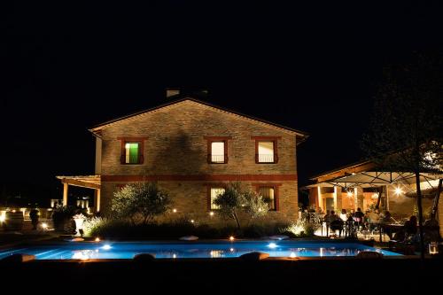 a house at night with lights in front of it at Agriturismo La Ratta in Vernasca