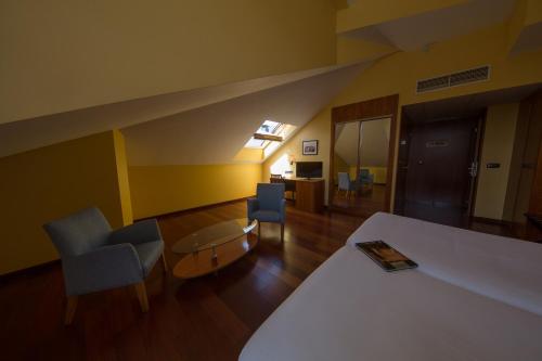 Postel nebo postele na pokoji v ubytování Hotel Aroi Bierzo Plaza