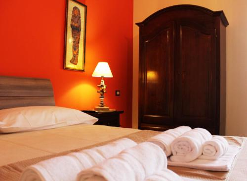 a bedroom with a bed with towels on it at Isolabella in Mazara del Vallo